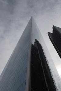 Modern Skyscraper Against Cloudy Sky
