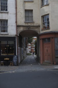 Cobblestone Alleyway Between Historic Buildings