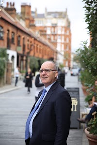 Man in Suit Standing on Street