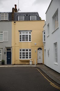 Yellow Terraced House with Bay Windows