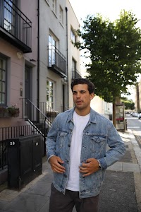 Young Man with Bicycle on Notting Hill Street