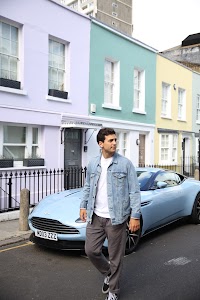 Young Man with Bicycle on Notting Hill Street