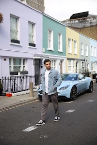Young Man with Bicycle on Notting Hill Street