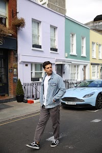 Young Man with Bicycle on Notting Hill Street
