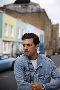 Young Man with Bicycle on Notting Hill Street