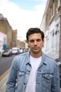 Young Man with Bicycle on Notting Hill Street
