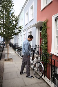 Young Man with Bicycle on Notting Hill Street