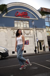 Woman Laughing on London Residential Street