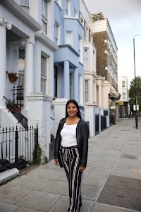 Woman Posing on a Cobblestone Mews Street