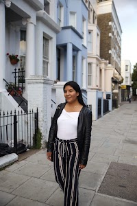 Woman Posing on a Cobblestone Mews Street