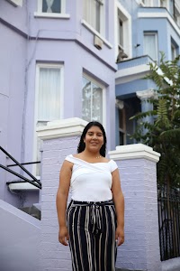 Woman Posing on a Cobblestone Mews Street