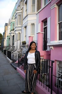 Woman Posing on a Cobblestone Mews Street