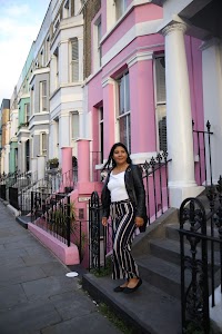 Woman Posing on a Cobblestone Mews Street