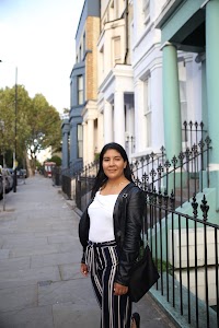 Woman Posing on a Cobblestone Mews Street