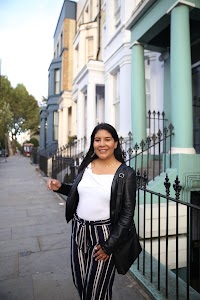 Woman Posing on a Cobblestone Mews Street
