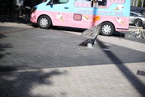 Pink and Blue Ice Cream Van on Paved Street