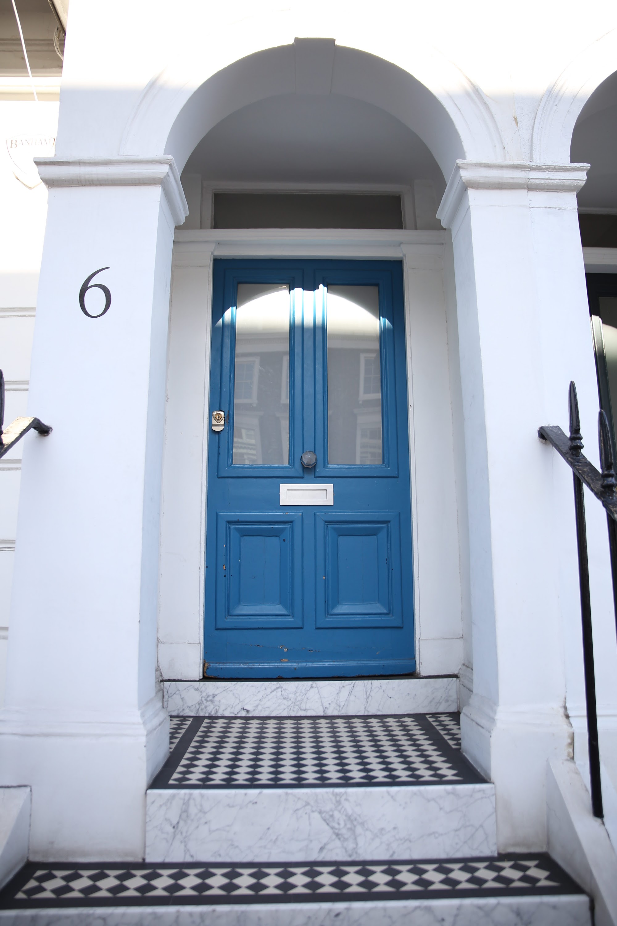 Blue Front Door of House Number 6