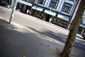 Street Scene with Historic Building and Pedestrians