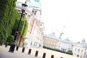Historic London Building with Ivy and Street Lamp