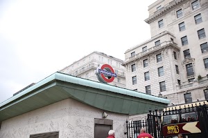 London Underground entrance with historic building backdrop