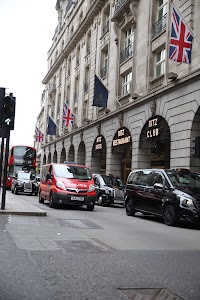 Ritz Hotel London with British Flags and Classic London Vehicles