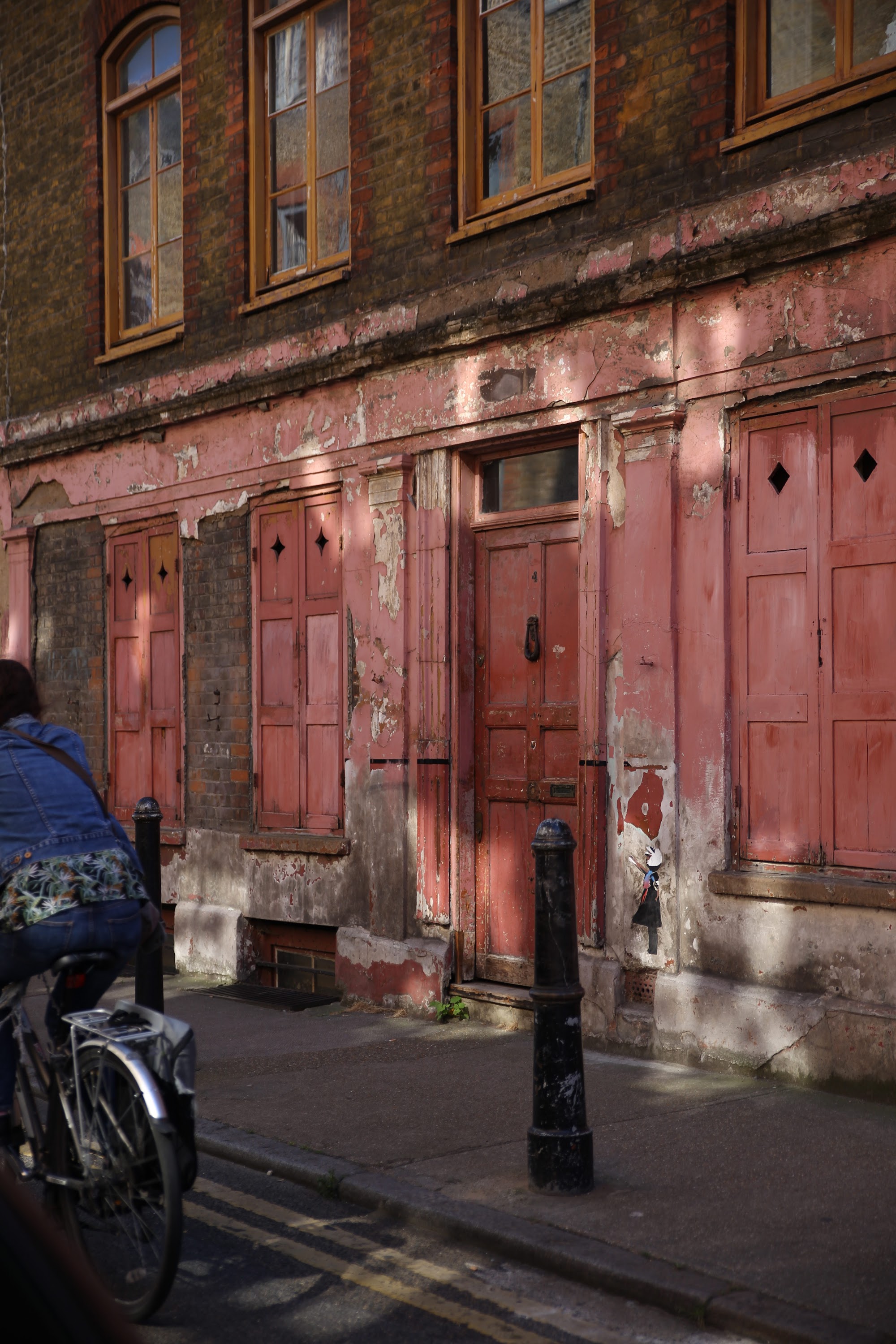 Weathered Red Door on Historic Brick Building