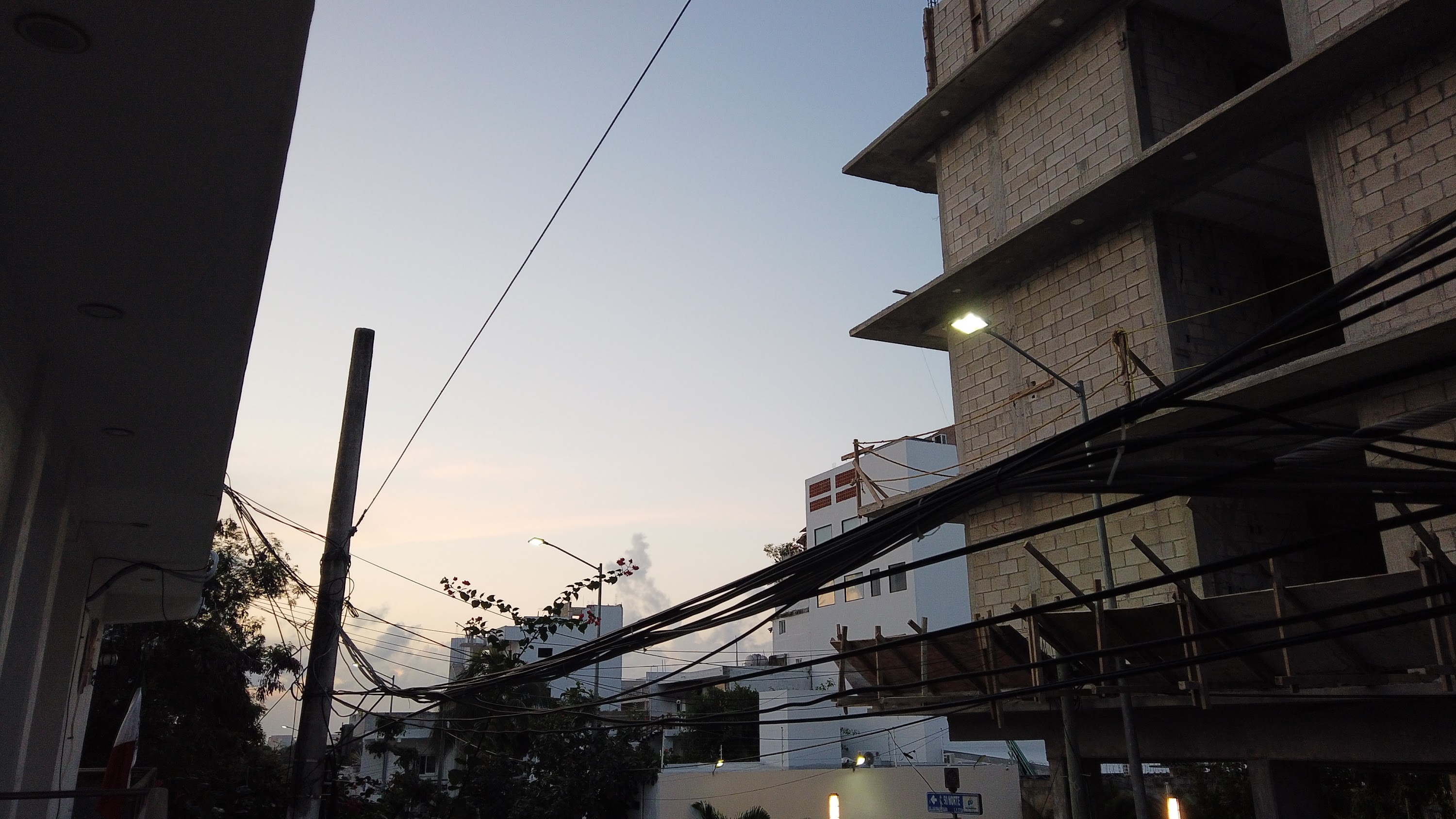 Multi-Story Concrete Building Under Construction at Dusk