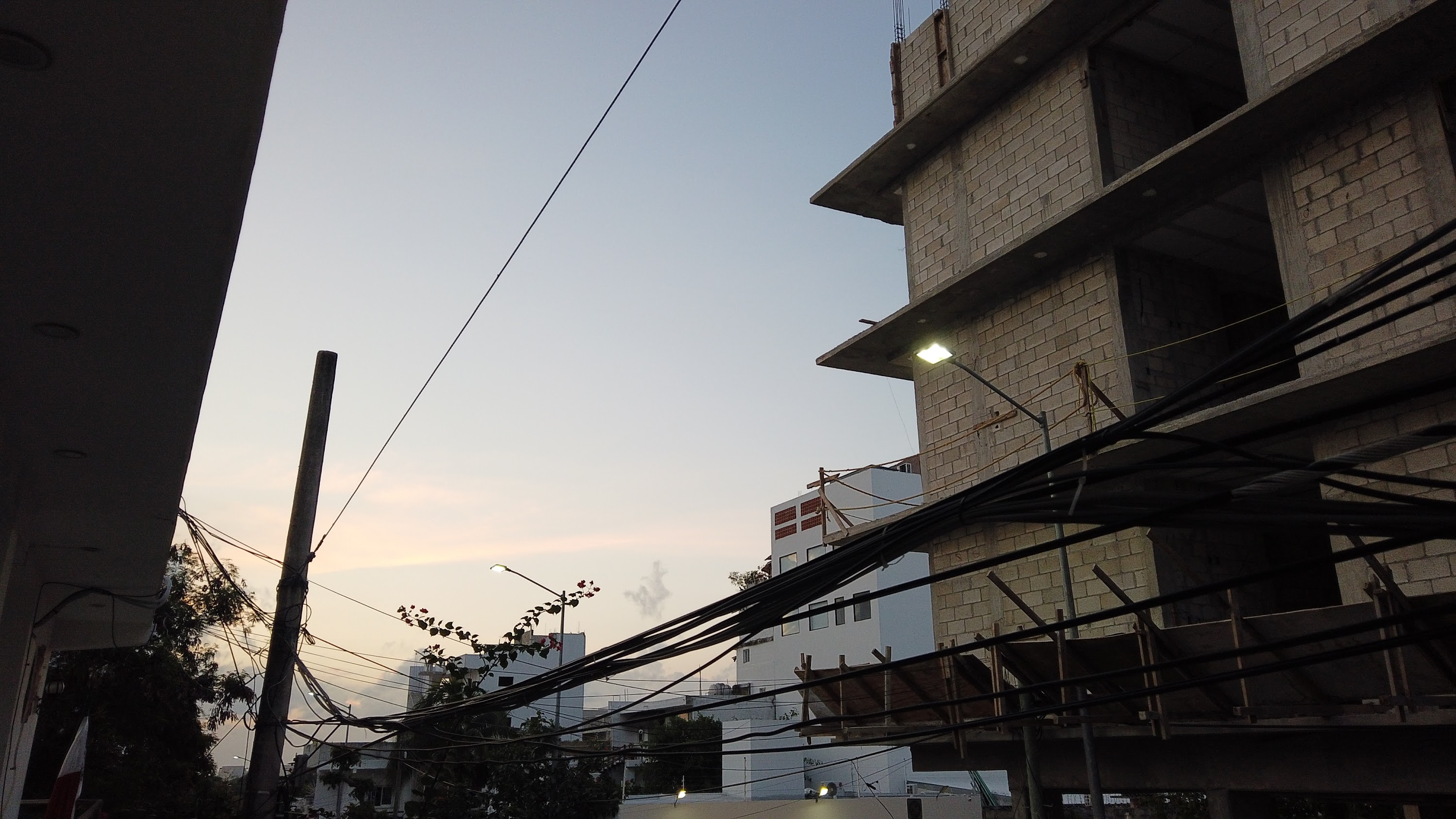Multi-Story Concrete Building Under Construction at Dusk