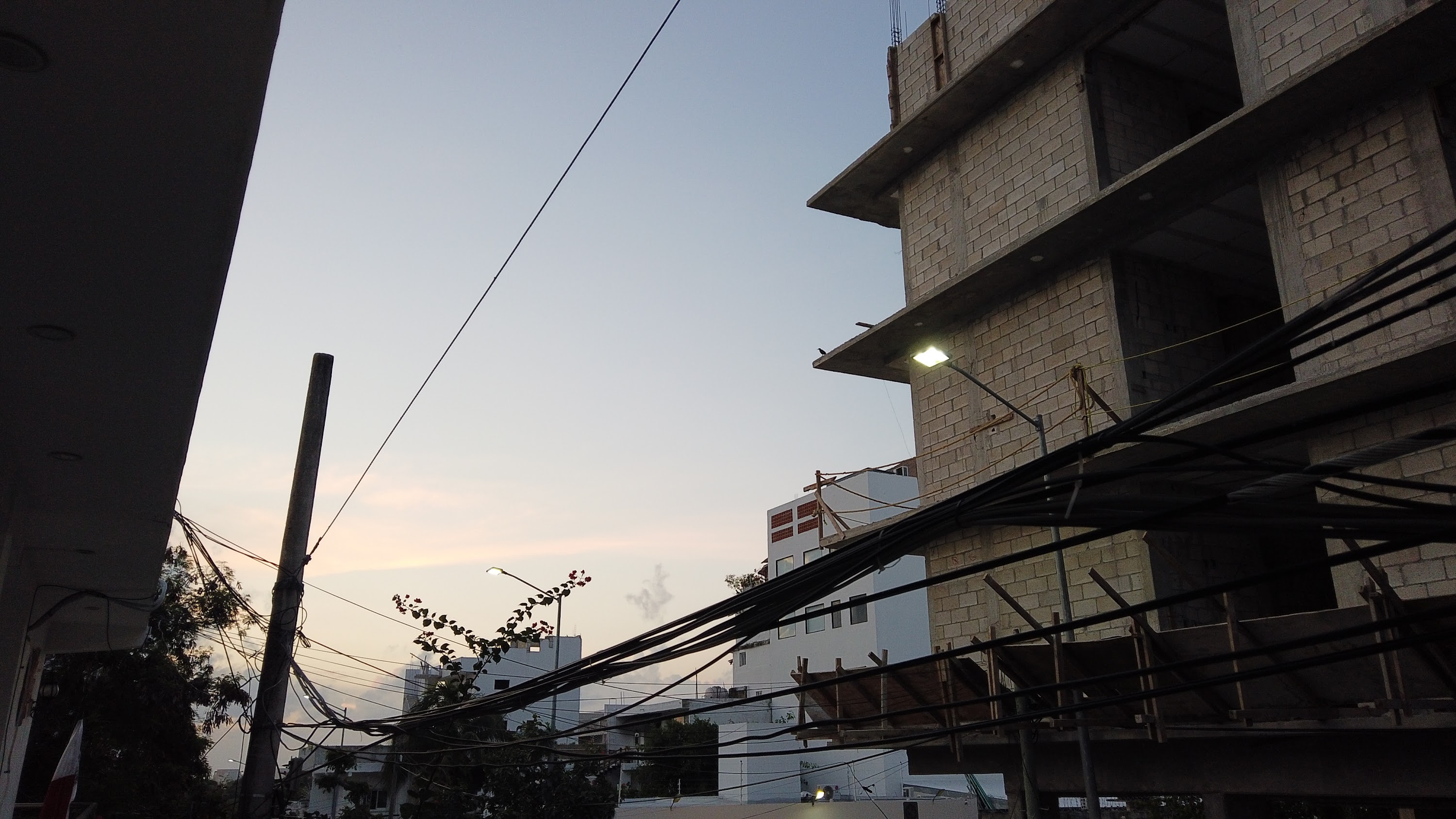Multi-Story Concrete Building Under Construction at Dusk
