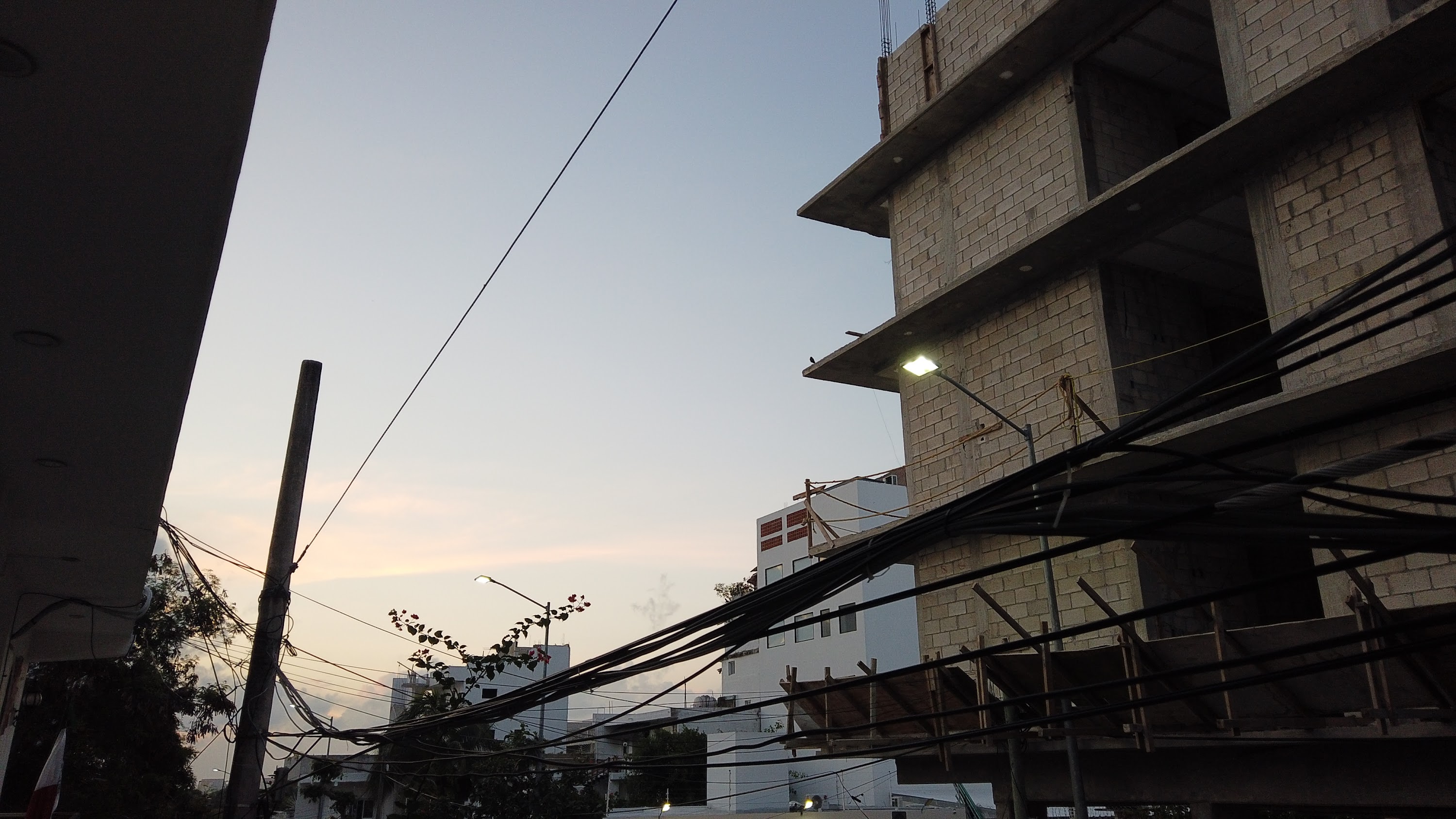 Multi-Story Concrete Building Under Construction at Dusk