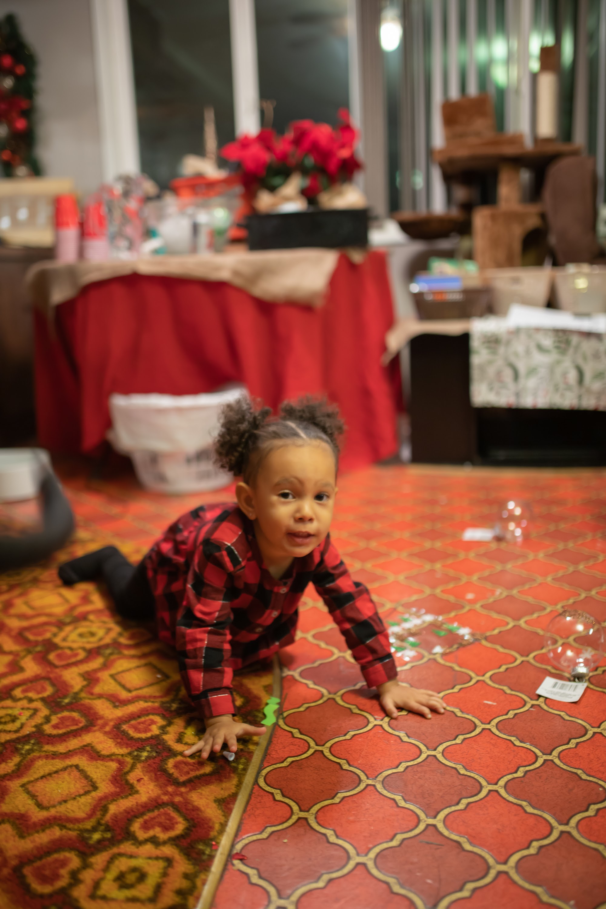 Toddler in Plaid Crawling on Patterned Rug