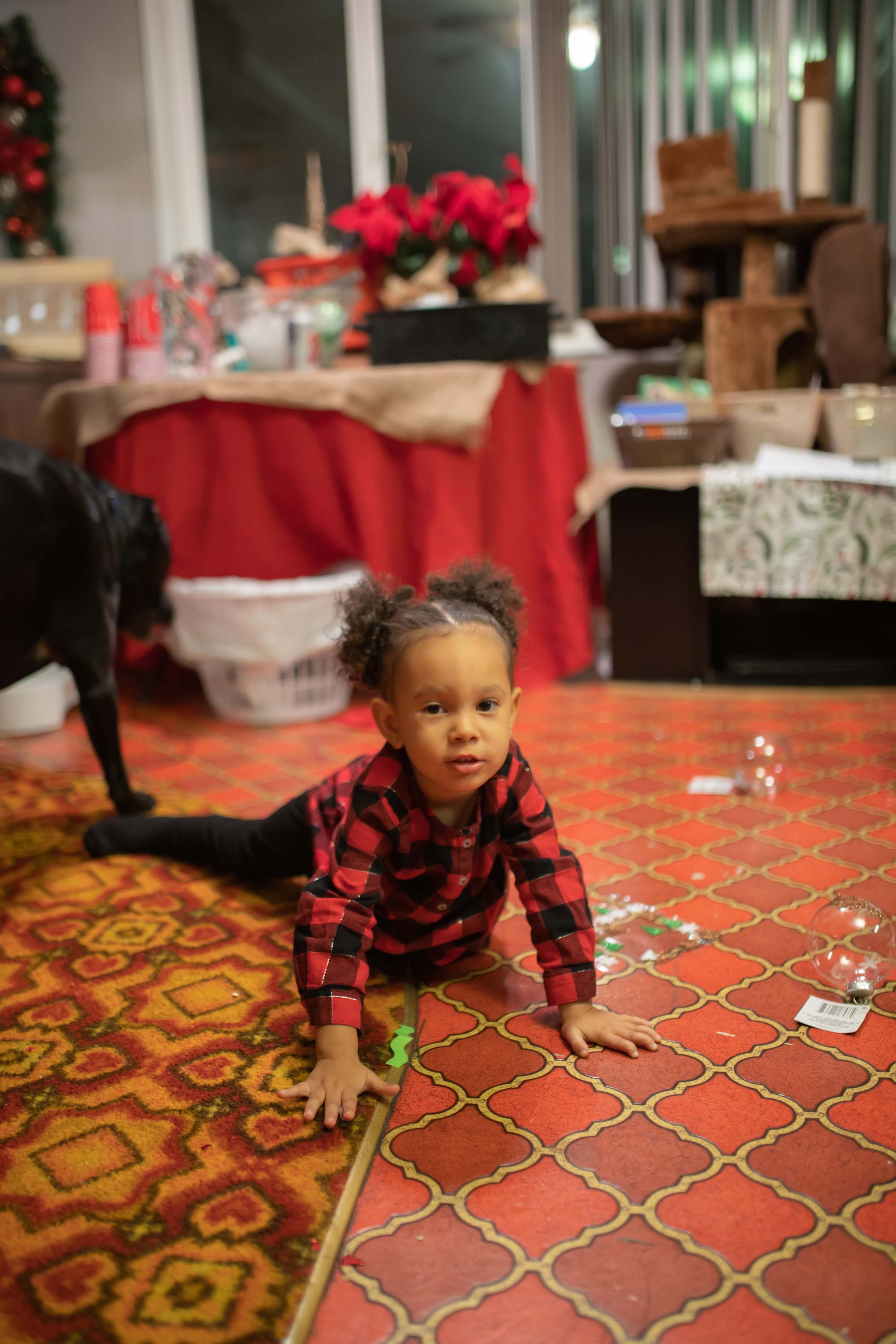 Young Girl in Plaid Shirt on Patterned Floor