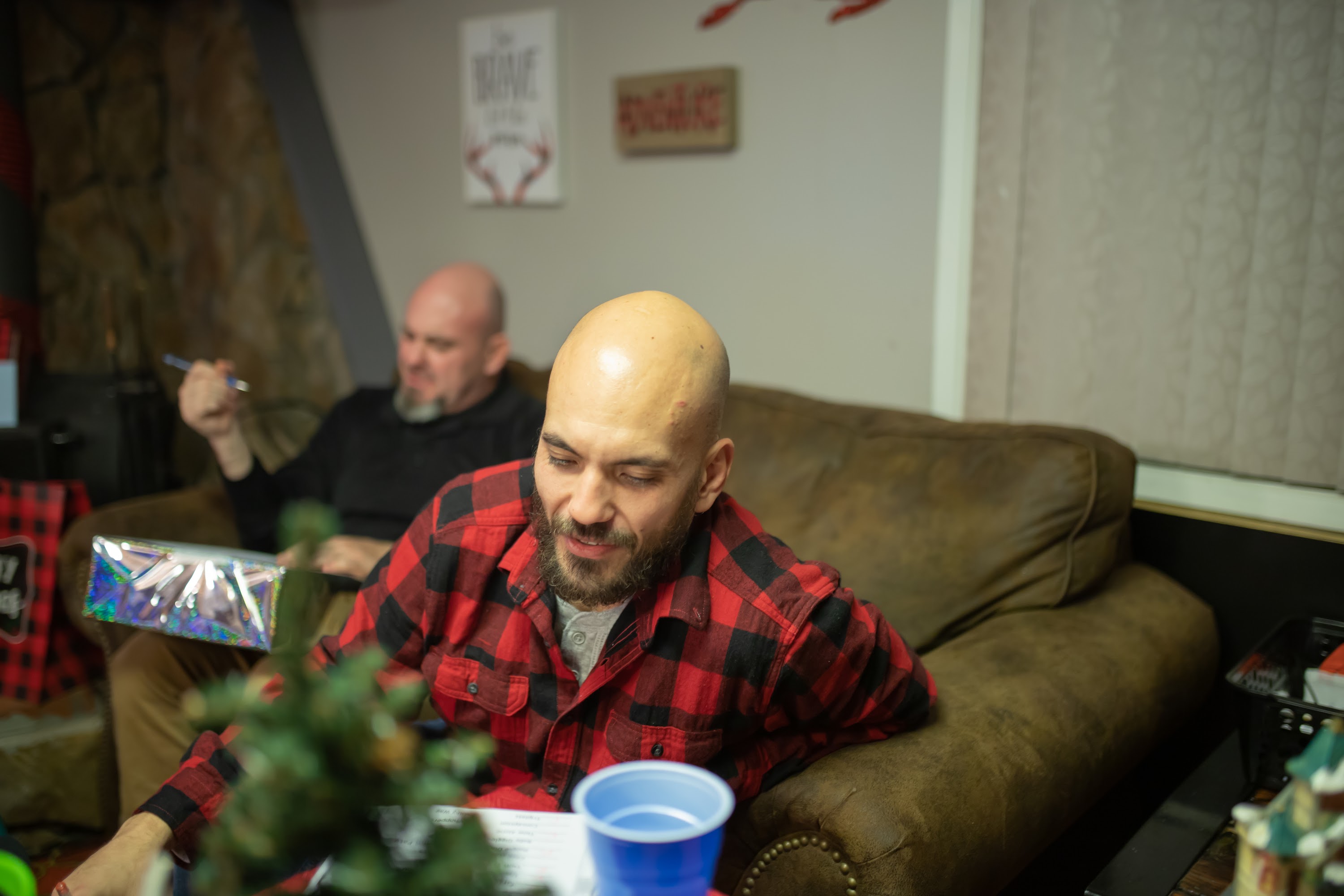 Men Relaxing at Home with Holiday Decorations