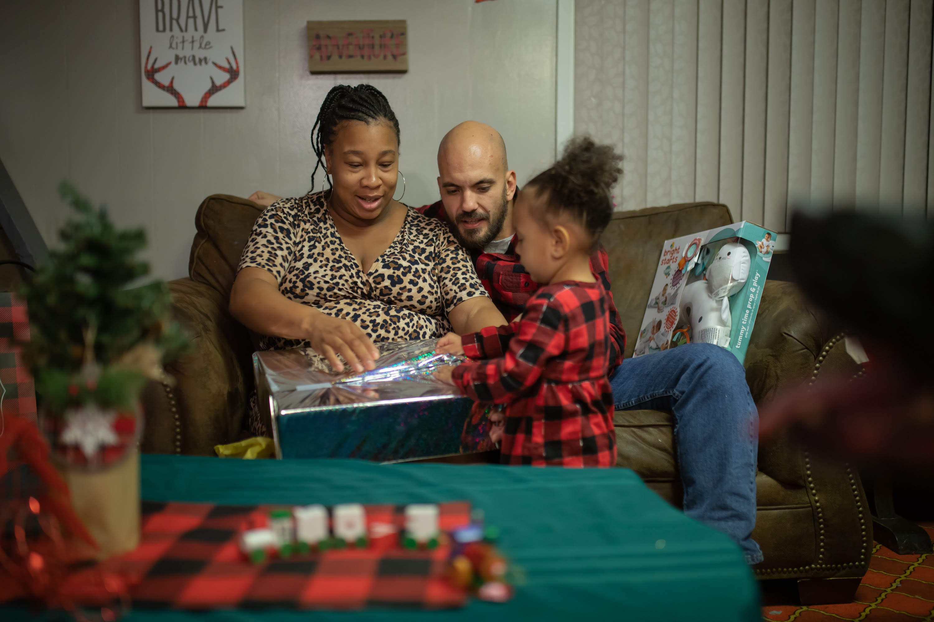 Family Unwrapping Christmas Gift