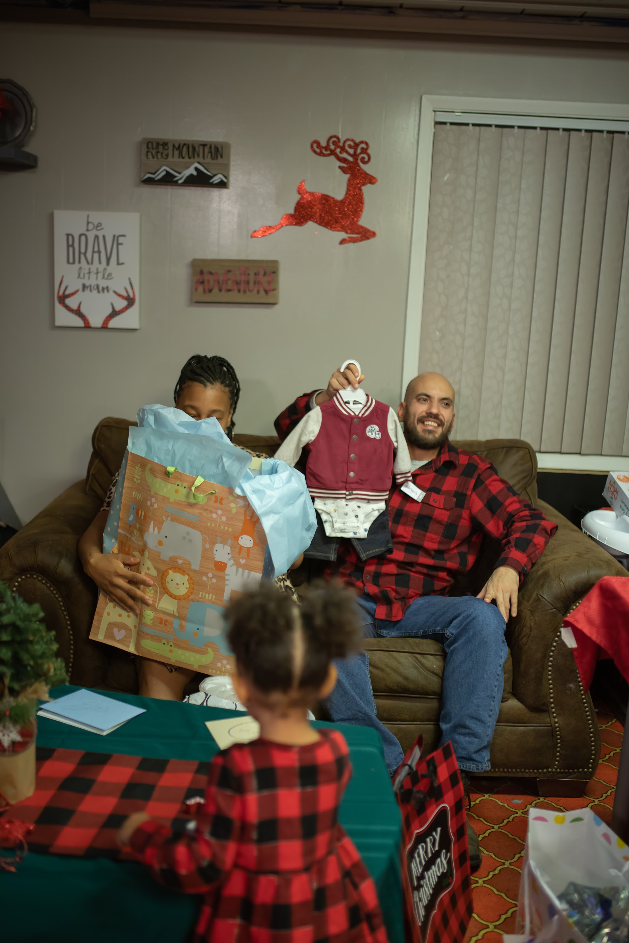 Family Celebrating Christmas with Gifts