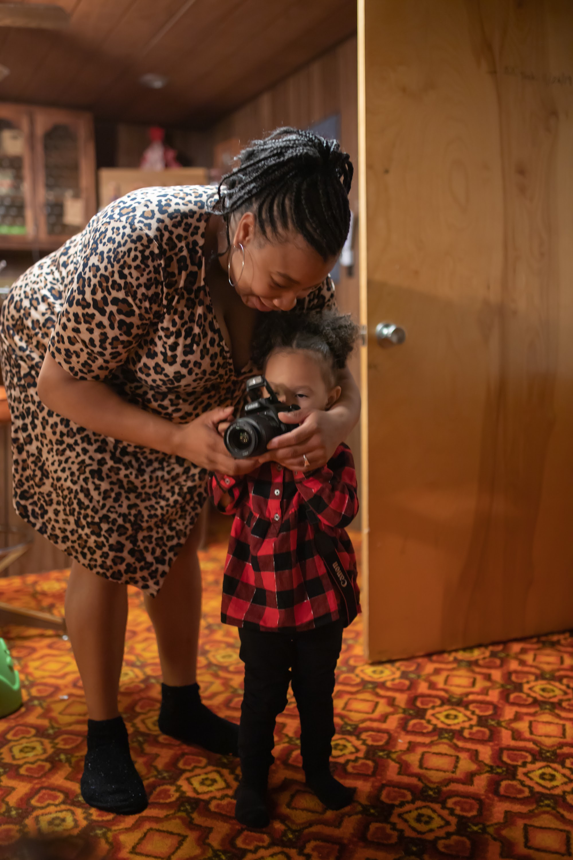 Mother and Child Sharing a Camera Moment