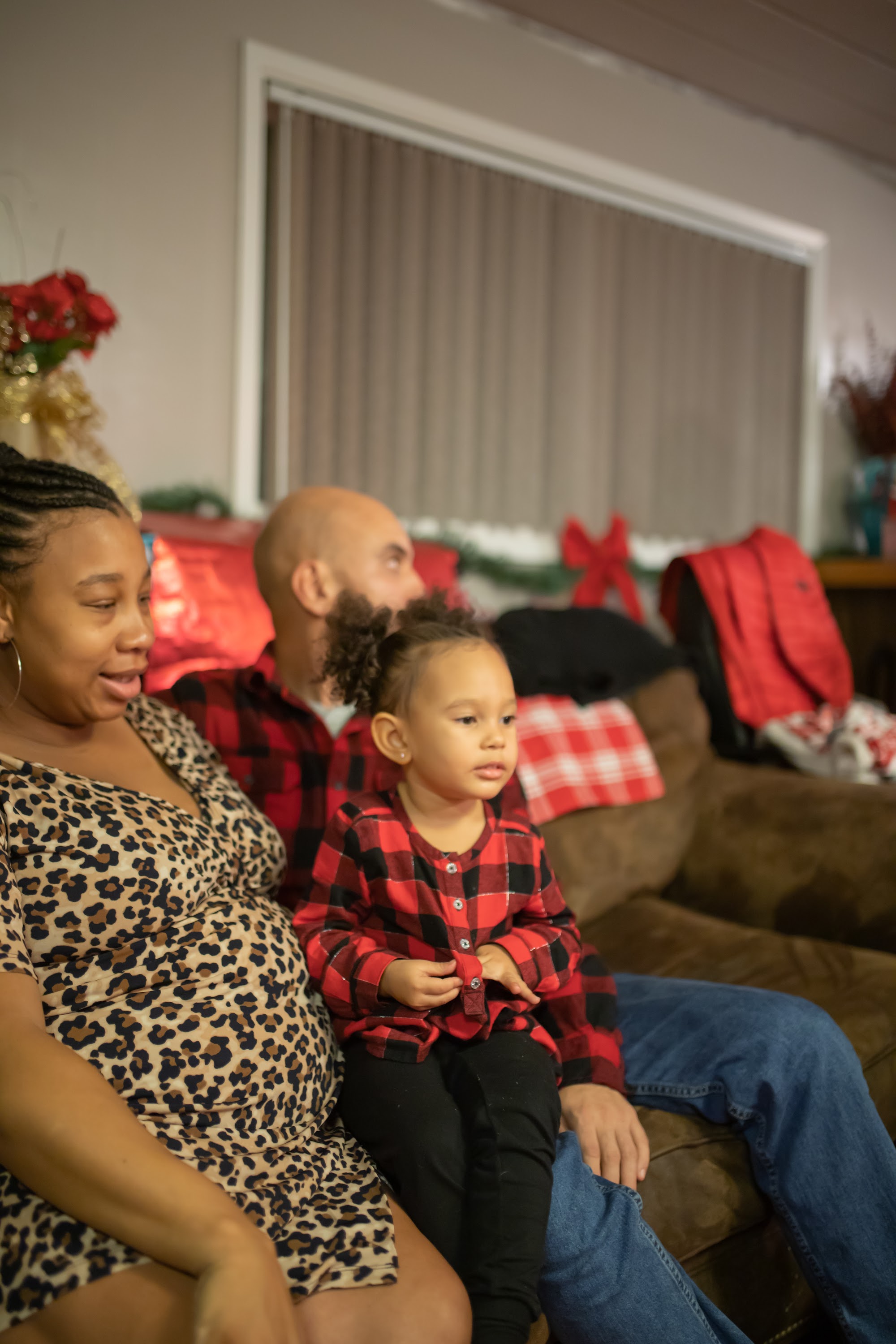 Family in Holiday Attire on Couch