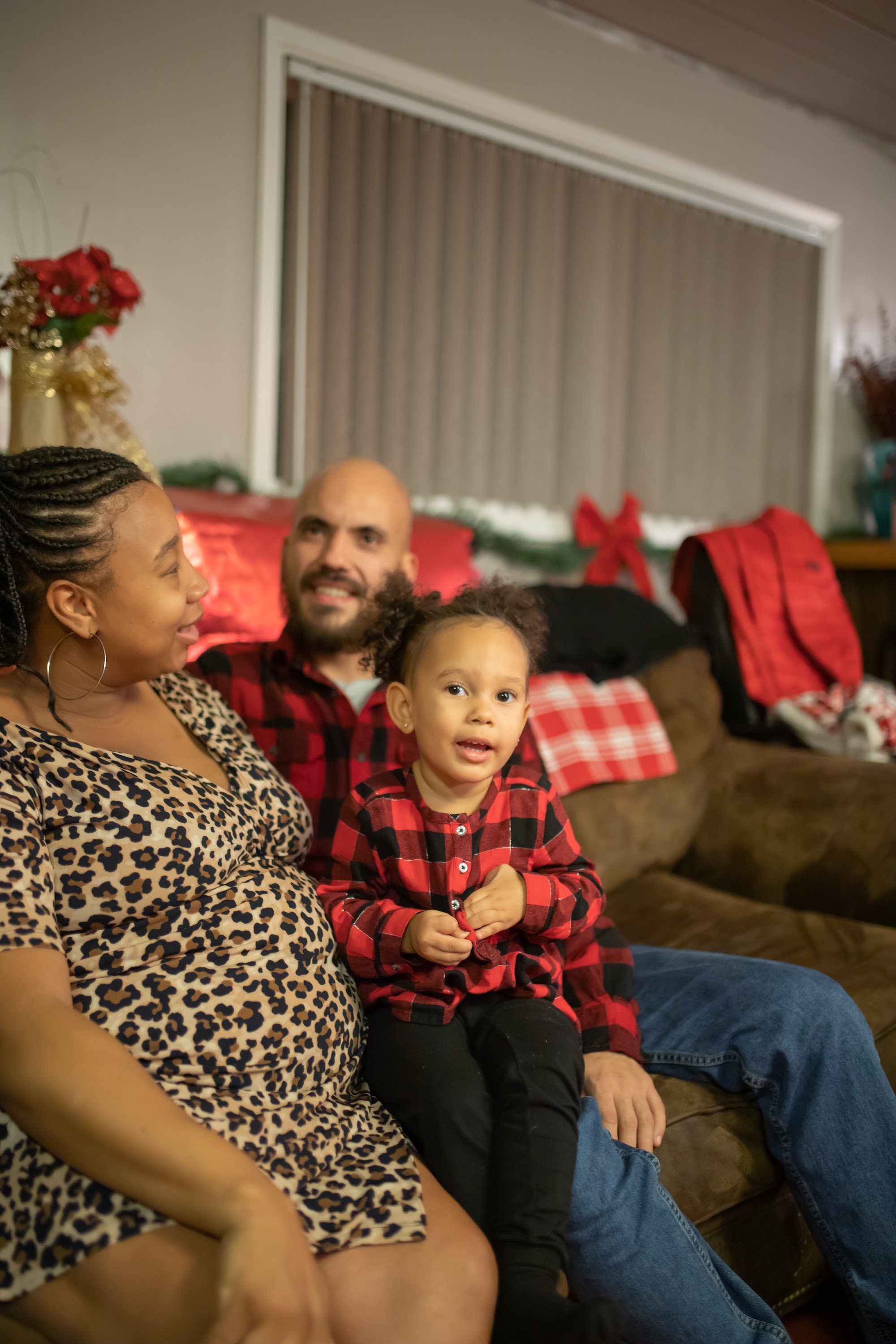Family in Holiday Attire on Couch
