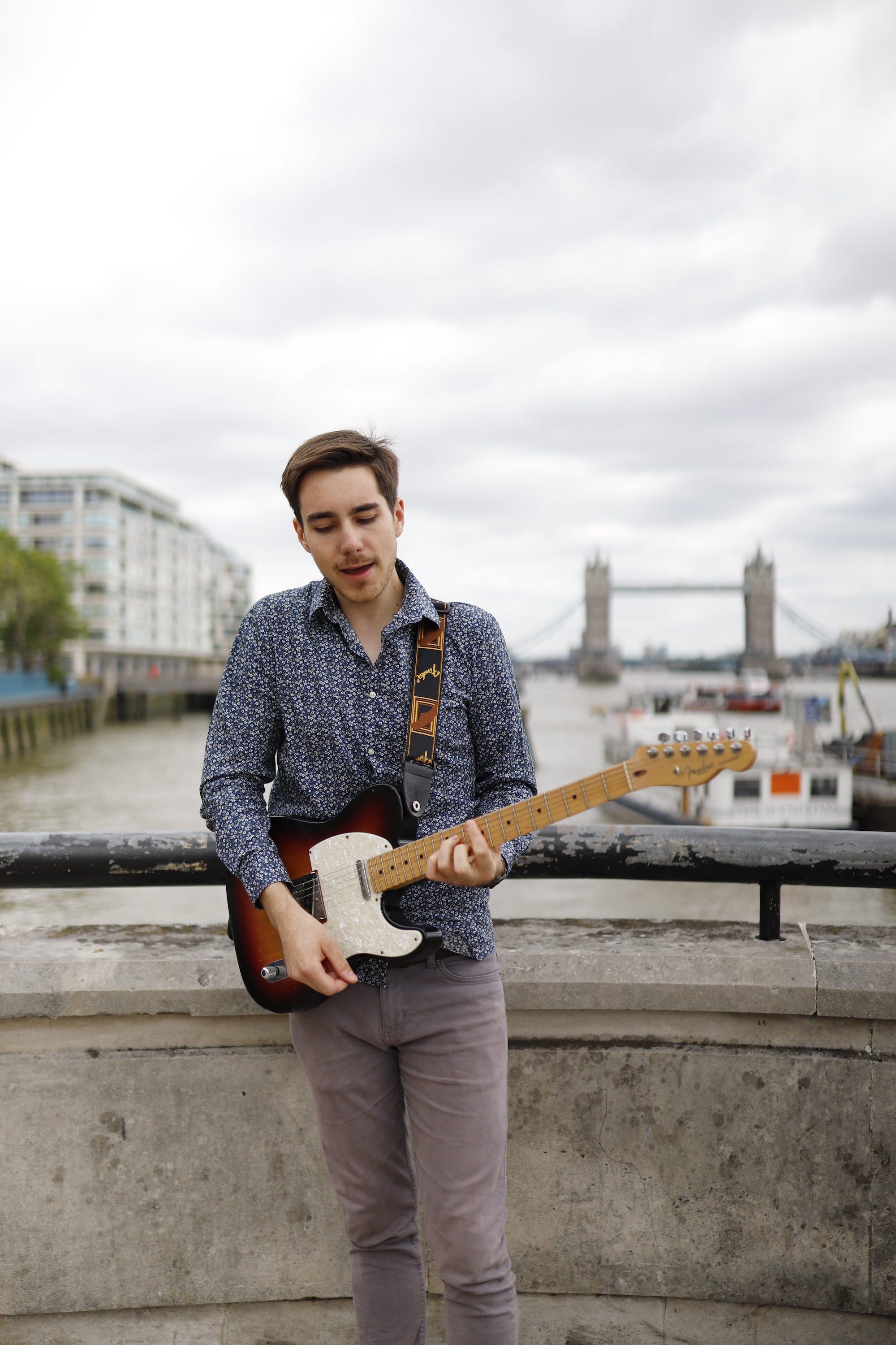 Guitarist Portrait on the Thames Embankment with Tower Bridge