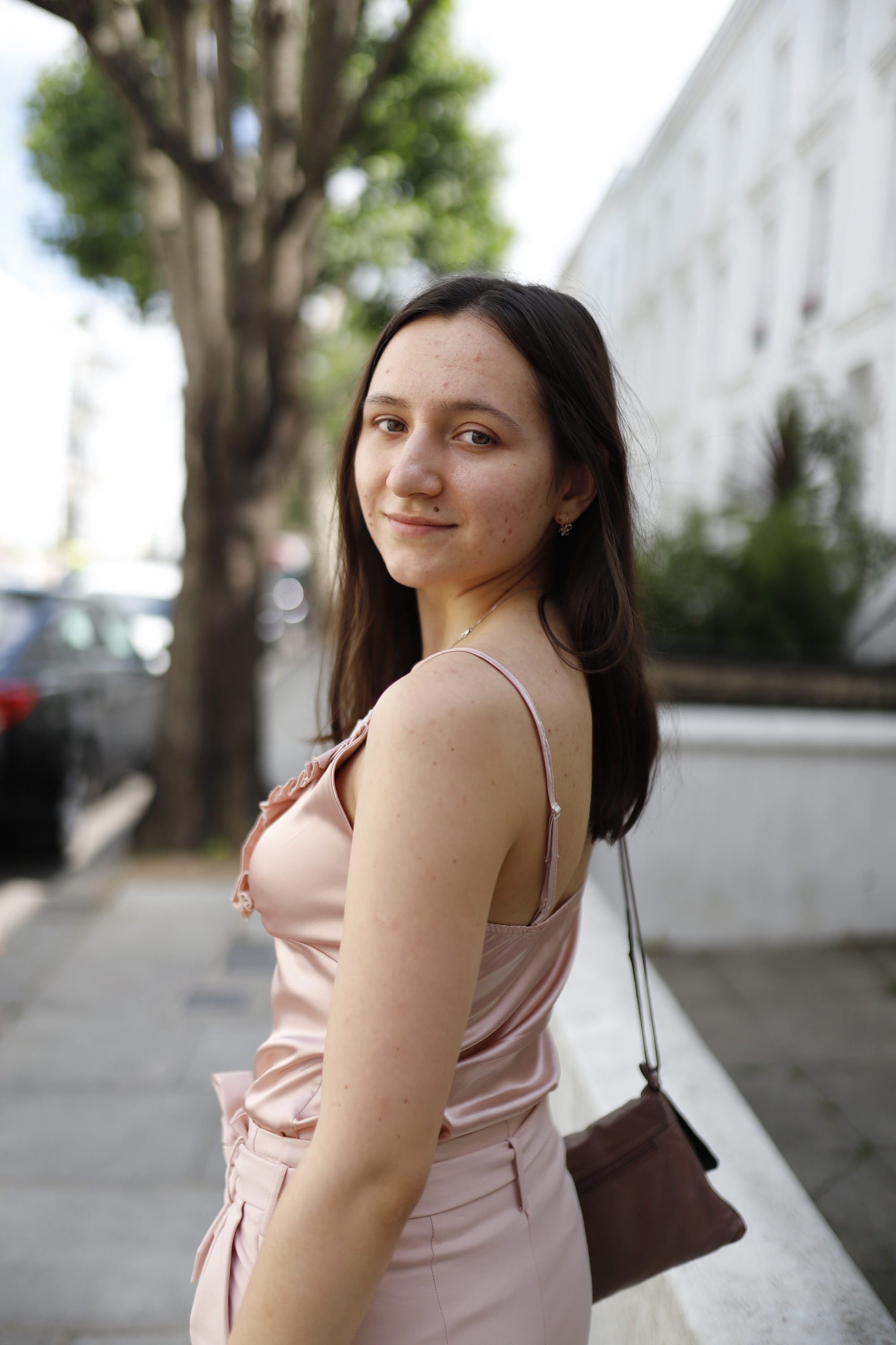 Young Woman in Pink Outfit on Notting Hill Street
