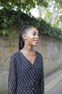 Woman Laughing on Thames Riverside Promenade