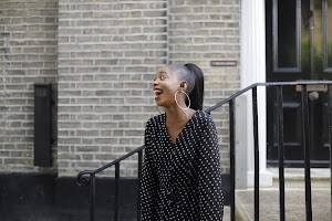 Woman Laughing on Thames Riverside Promenade