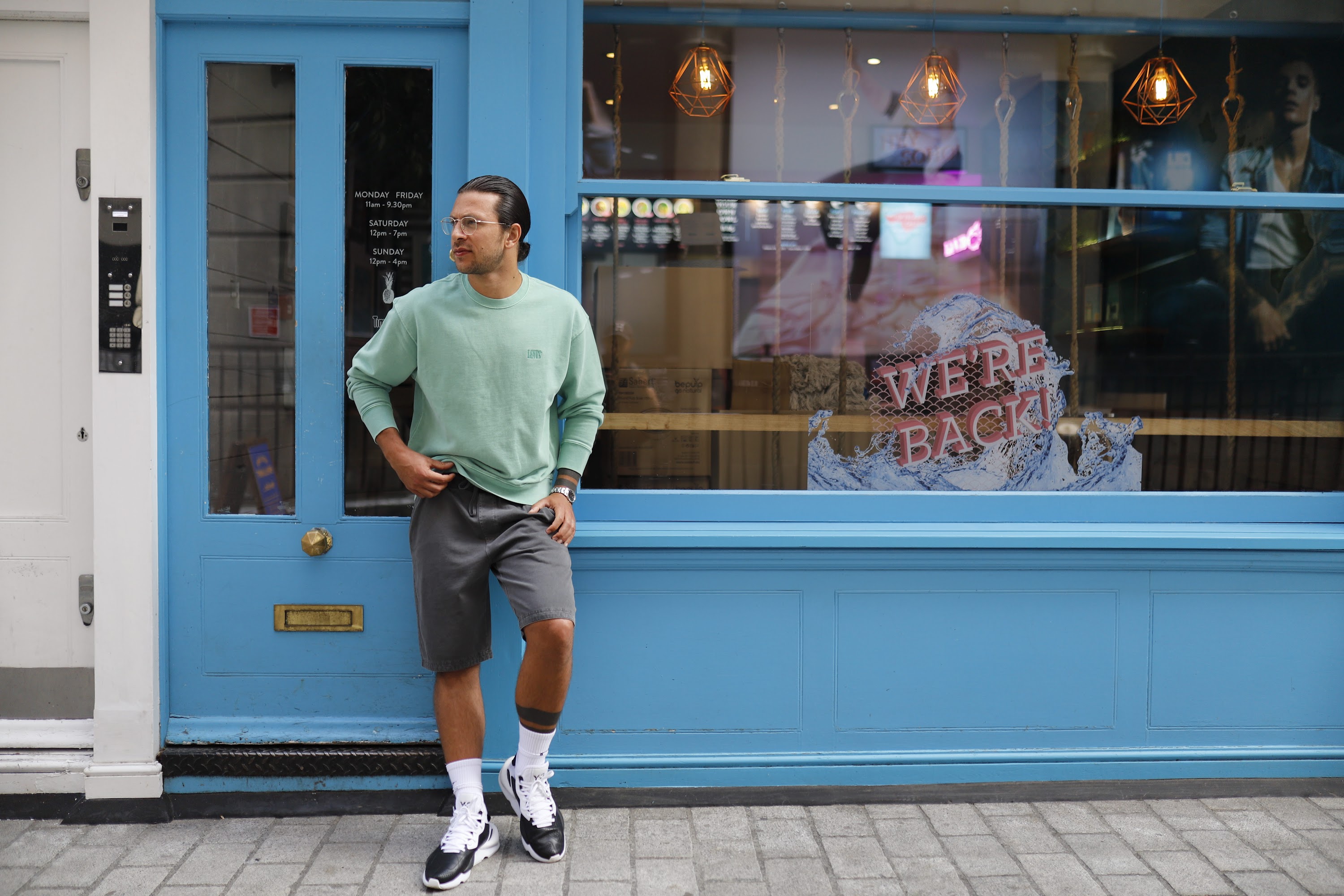 Man Walking Through Outdoor Dining Courtyard