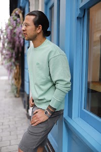 Man Walking Through Outdoor Dining Courtyard