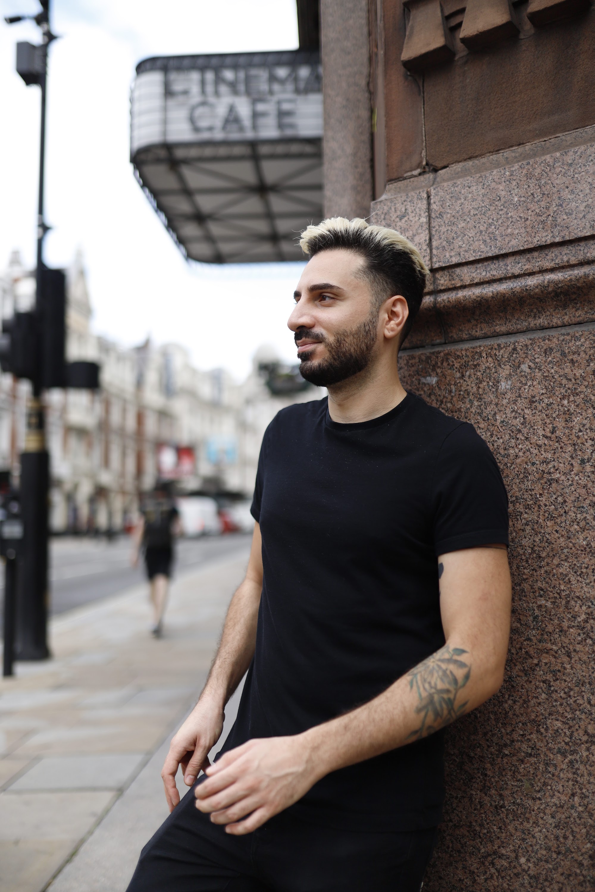 Young Man in Black on Urban Street