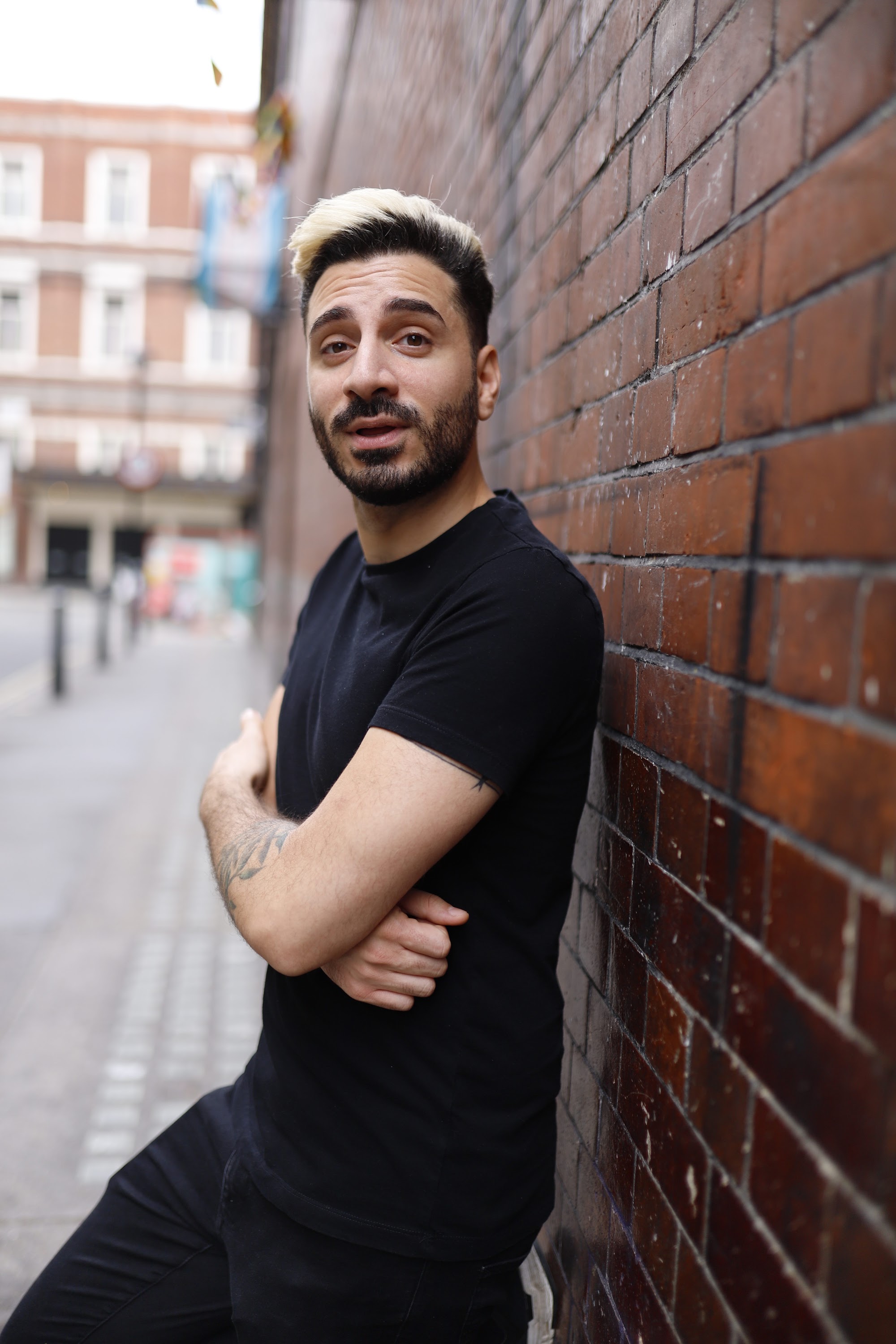 Young Man in Black on Urban Street