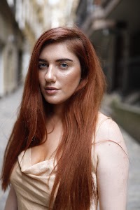 Red-Haired Woman Portrait with Tower Bridge, London