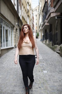 Red-Haired Woman Portrait with Tower Bridge, London