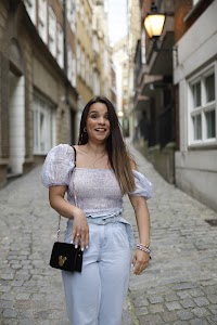 Woman Posing in European Cobblestone Alley