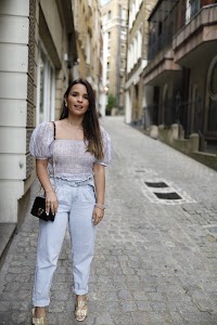 Woman Posing in European Cobblestone Alley